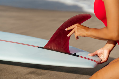 Surf woman with long blonde hair go to ocean.