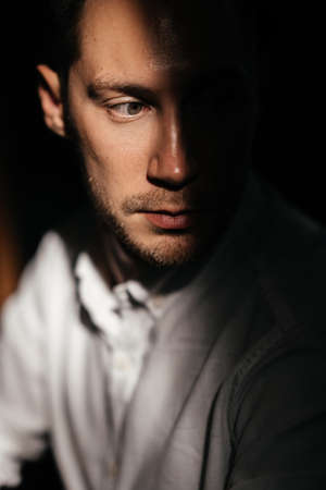 portrait of handsome man sitting in cafeの写真素材