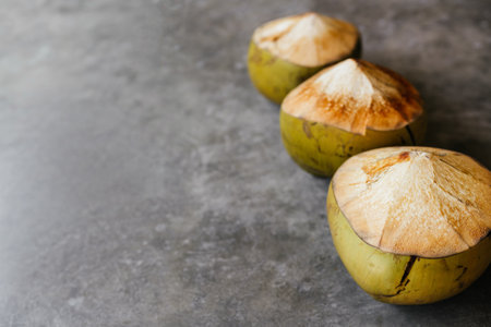The young coconut is tasty for drinking juice on stone backgroundの写真素材