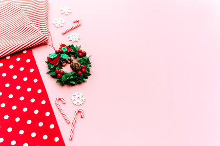 Christmas composition. Christmas gifts, pine branches, toys on pink background.の写真素材