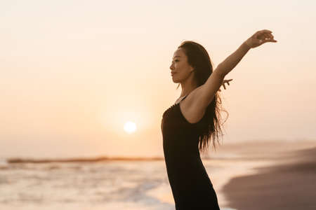 Smile Freedom and happiness chinese woman on beach.の写真素材