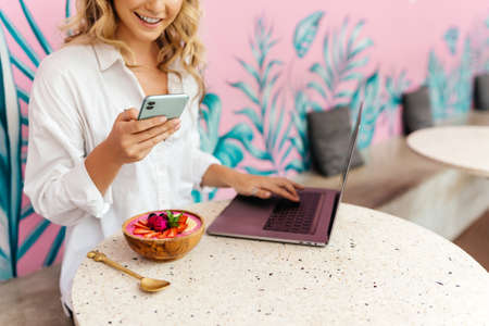 Pretty Young Beauty Woman Using Laptop in cafe, outdoor portrait business woman, hipster style, internet, smartphone, office,の写真素材
