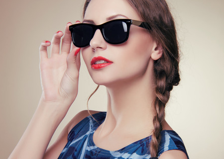 beautiful and fashion girl in sunglasses, close-up portrait, studio shotの写真素材