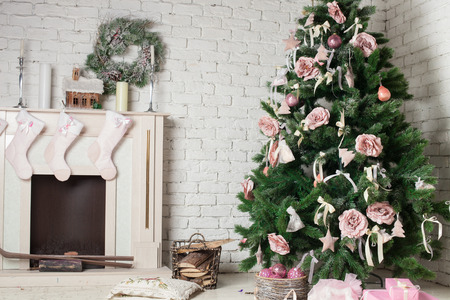 Image of chimney and decorated xmas tree with giftの写真素材