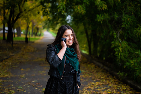 Young businesswoman having a conversation using a smartphone on a phone call.