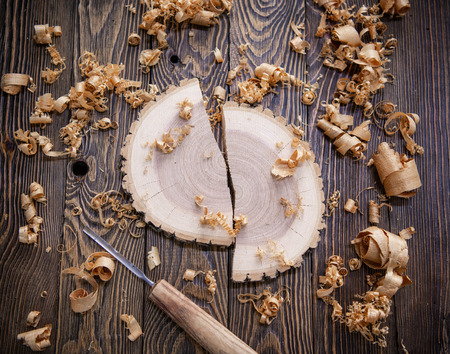 Joiner tools and shavings on wood table background at the workshopの写真素材