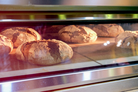 Bread rolls baked in an industrial oven closeup photo