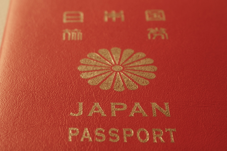 Japan passport cover toned blurred closeup background photo