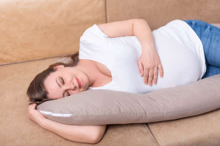 pregnant woman on a pillow for pregnant womenの写真素材