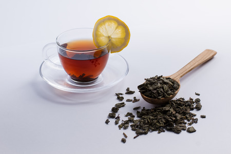 Cup of tea. Natural tea in a wooden spoon. Organic natural tea with lemon.の写真素材
