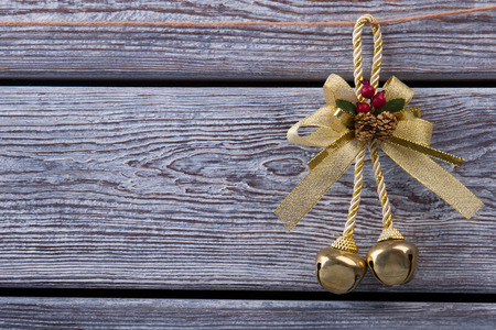 Golden bell with pine cones. New Year decoration. Christmas toy for Christmas tree.の写真素材