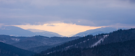 Luxury mountain panorama. Dark clouds over the mountains. Silhouette of mountains.の写真素材