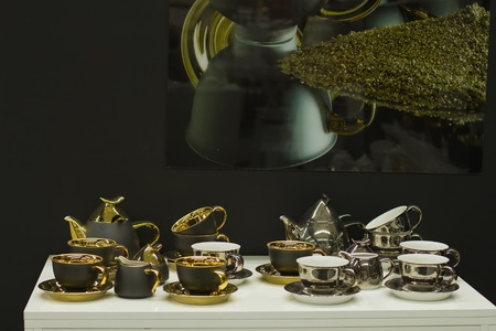 set of exclusive handmade gilded cupsの写真素材