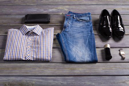 New stylish men's clothing on store shelf.の写真素材