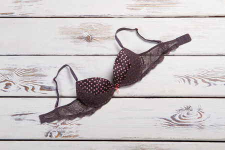 Stylish lace bra on the old wooden background.の写真素材