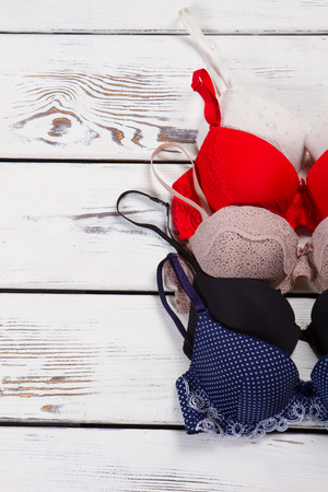 Part of beautiful bras. Lingerie on the wooden background.の写真素材