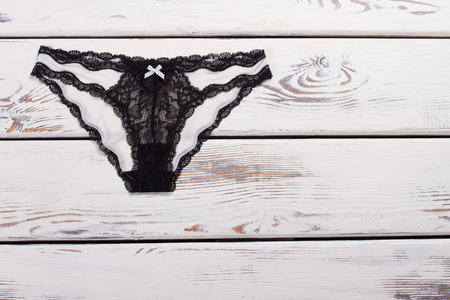 Black and white panties. Underwear made of silk and lace. Sophistication lingerie.