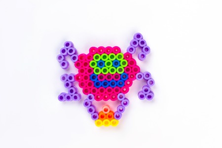 Perler bead spider. Close up. White isolated background.