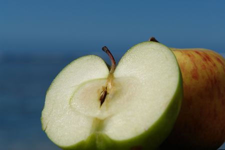 distinct green apple, on blue bottom of a tropical lagoon,の写真素材