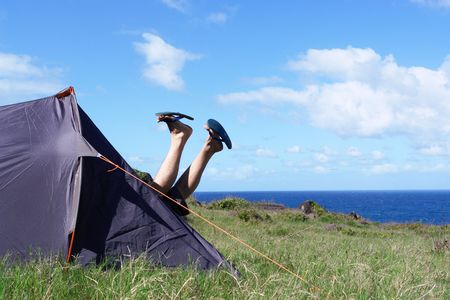 camp-site, tries and leg in the air on bottom ocean, holidays,の写真素材