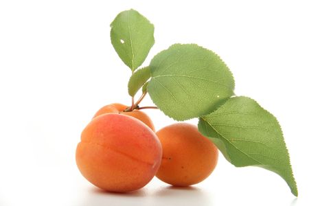 apricot with leaf, isolated on white backgroundの写真素材