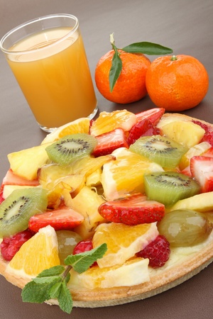fruit tarta and orange juiceの写真素材