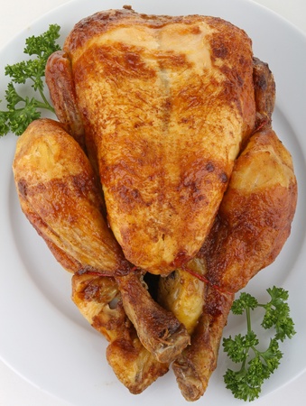 plate of roast chickenの写真素材