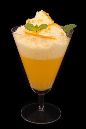 glass of fruit mousse on black backgroundの写真素材