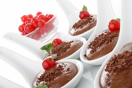 spoon of dessert, chocolate mousse and currantの写真素材