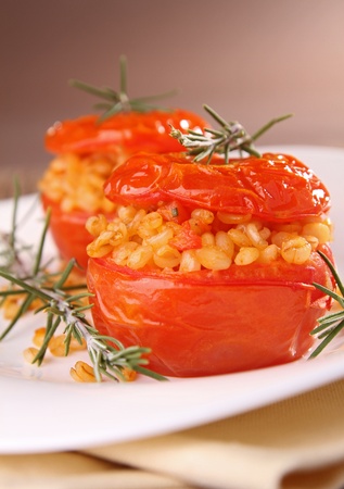gourmet plate of stuffed tomatoの写真素材