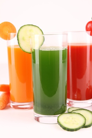 glass of juice on whiteの写真素材