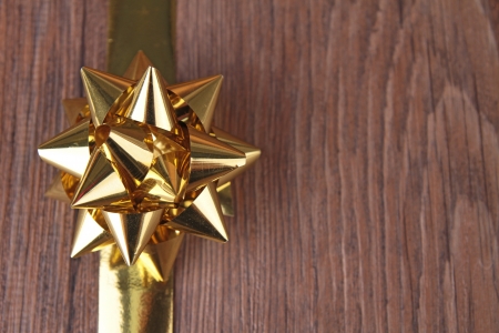 ribbon bow on woodの写真素材