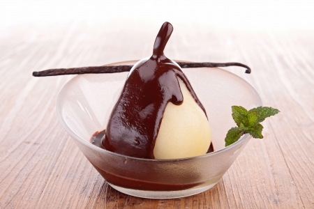 pear with chocolate sauceの写真素材