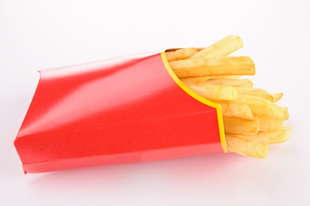 french fries in paper bag isolated on white