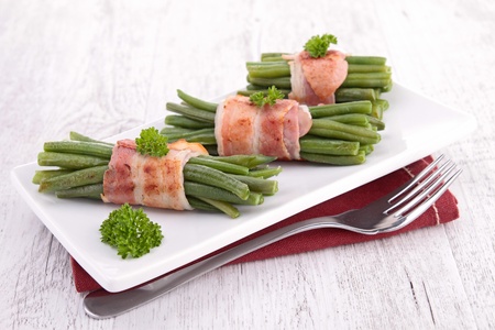 green bean rolled with baconの写真素材