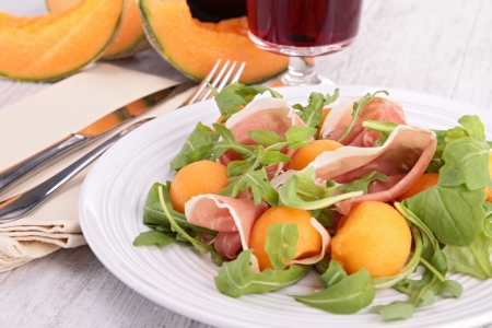 plate of melon salad and prosciuttoの写真素材