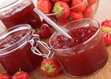strawberry jam on wood backgroundの写真素材