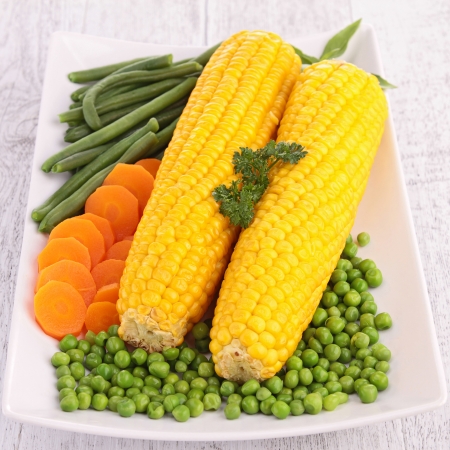 plate of corn and vegetablesの写真素材