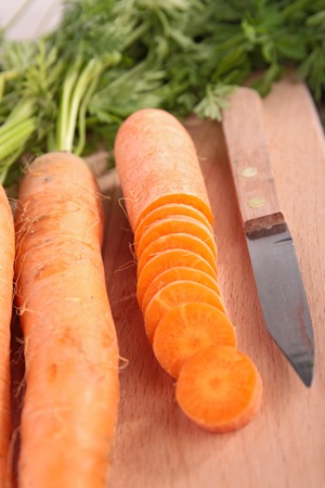 raw carrot on boardの写真素材