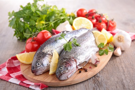 raw fish on boardの写真素材