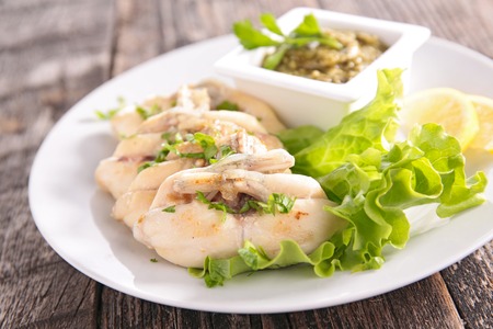 frog leg with parsley and salad
