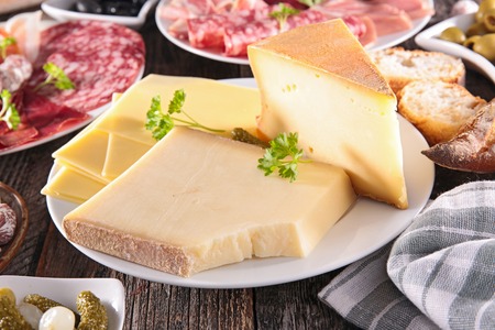 plate of cheese on tableの写真素材