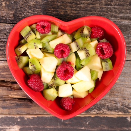 fruit salad in heart shaped bowlの写真素材