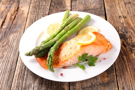 baked salmon fillet and asparagusの写真素材