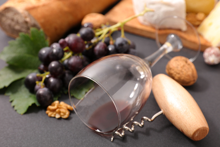 glass with wine and grapeの写真素材