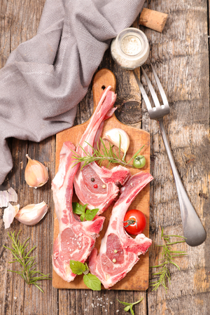 raw lamb chop with rosemaryの写真素材