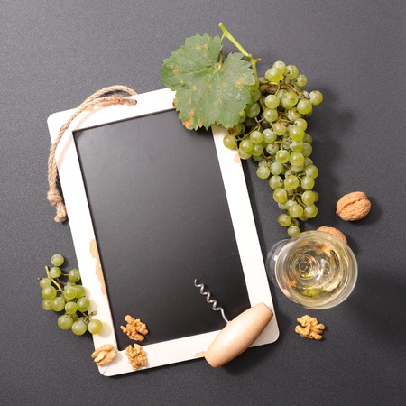 blackboard with grape and wineの写真素材