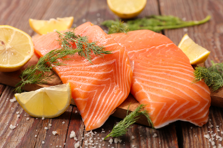 raw salmon with lemon and dillの写真素材