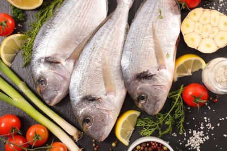 raw fish with ingredientsの写真素材