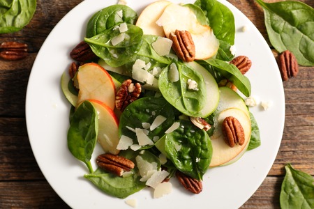 spinach salad with apple,cheese and pecan nutの写真素材